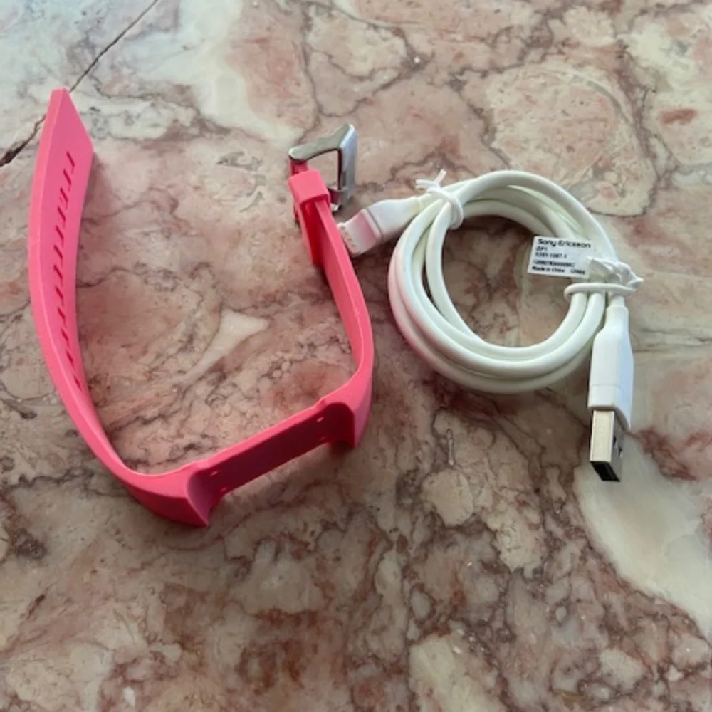 First generation Sony watch band in pink and power cord only *no watch* NEW